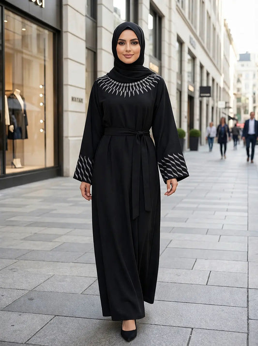 Woman wearing a black Bisma Nida Abaya with Matching Belt for modest fashion in the UK | Alnoors Collections