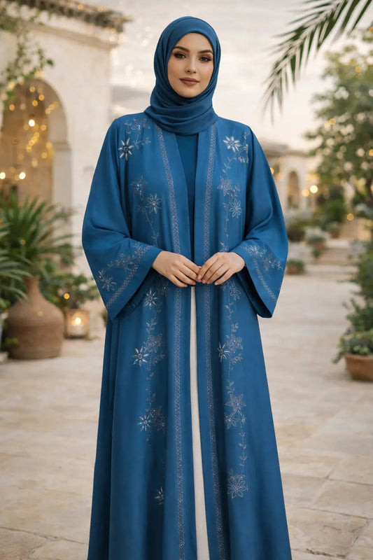 Blue embroidered Nida Abaya worn by a model, showcasing elegant modest fashion in the UK